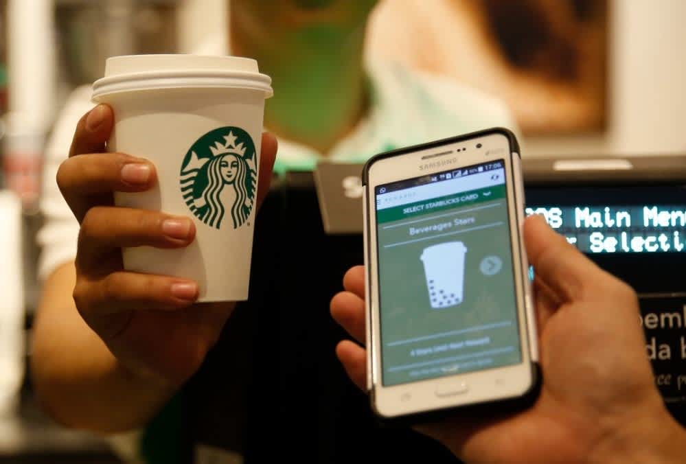 starbucks mobile app next to cup