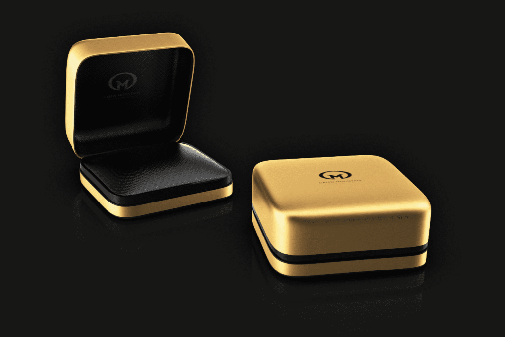 Gold ring box with black accents and outer cover