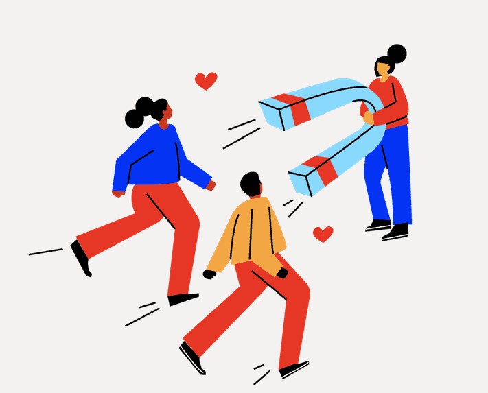 A woman points a giant magnet towards two other people