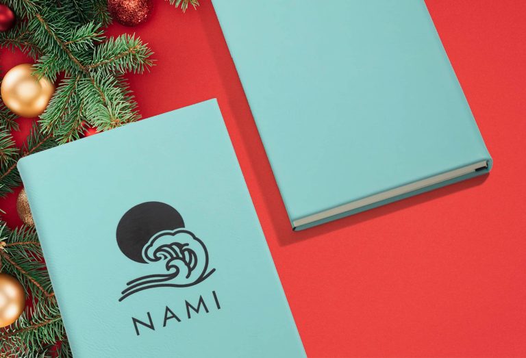 Blue notebook with black text and branded graphic