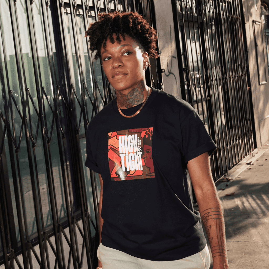 A person with a custom T-shirt design for High and Tight business