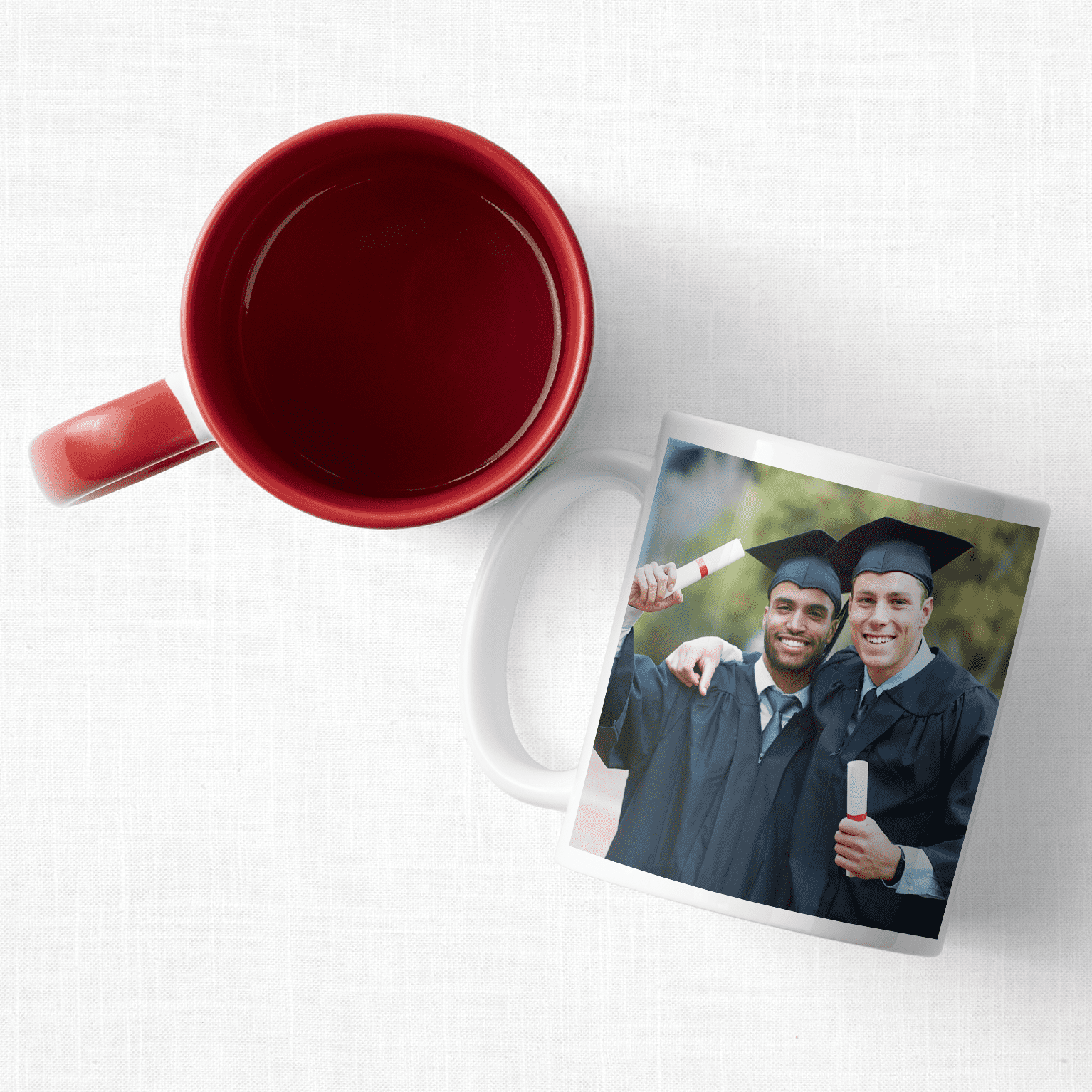 Two custom mugs one featuring a photo of two graduates