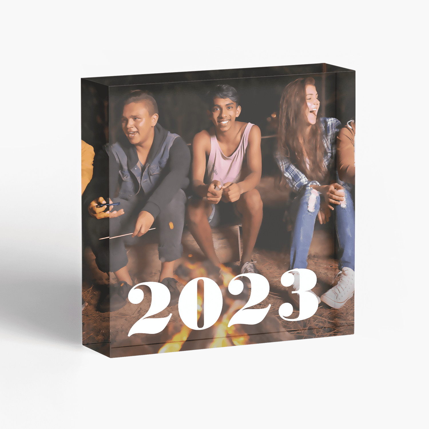 Acrylic photo block featuring three young people and text reading the year 2023