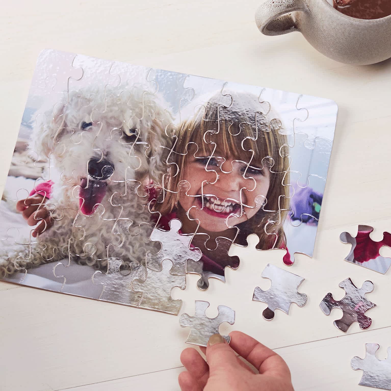 A custom puzzle with a photo of a little girl and a dog