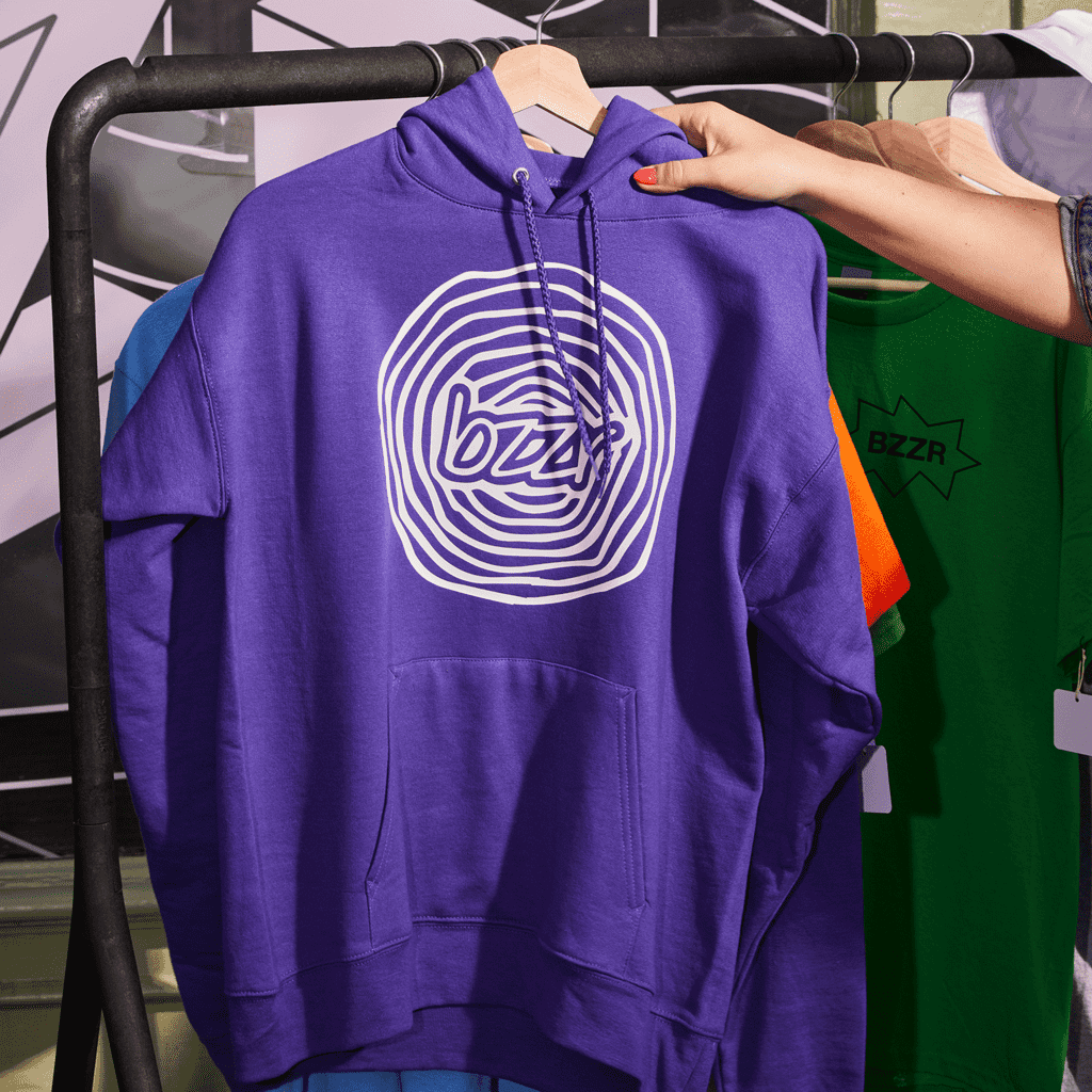 Purple hoodie with circular design on it