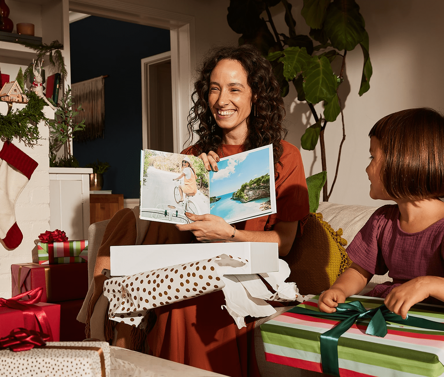 A person opening a gift of a photobook