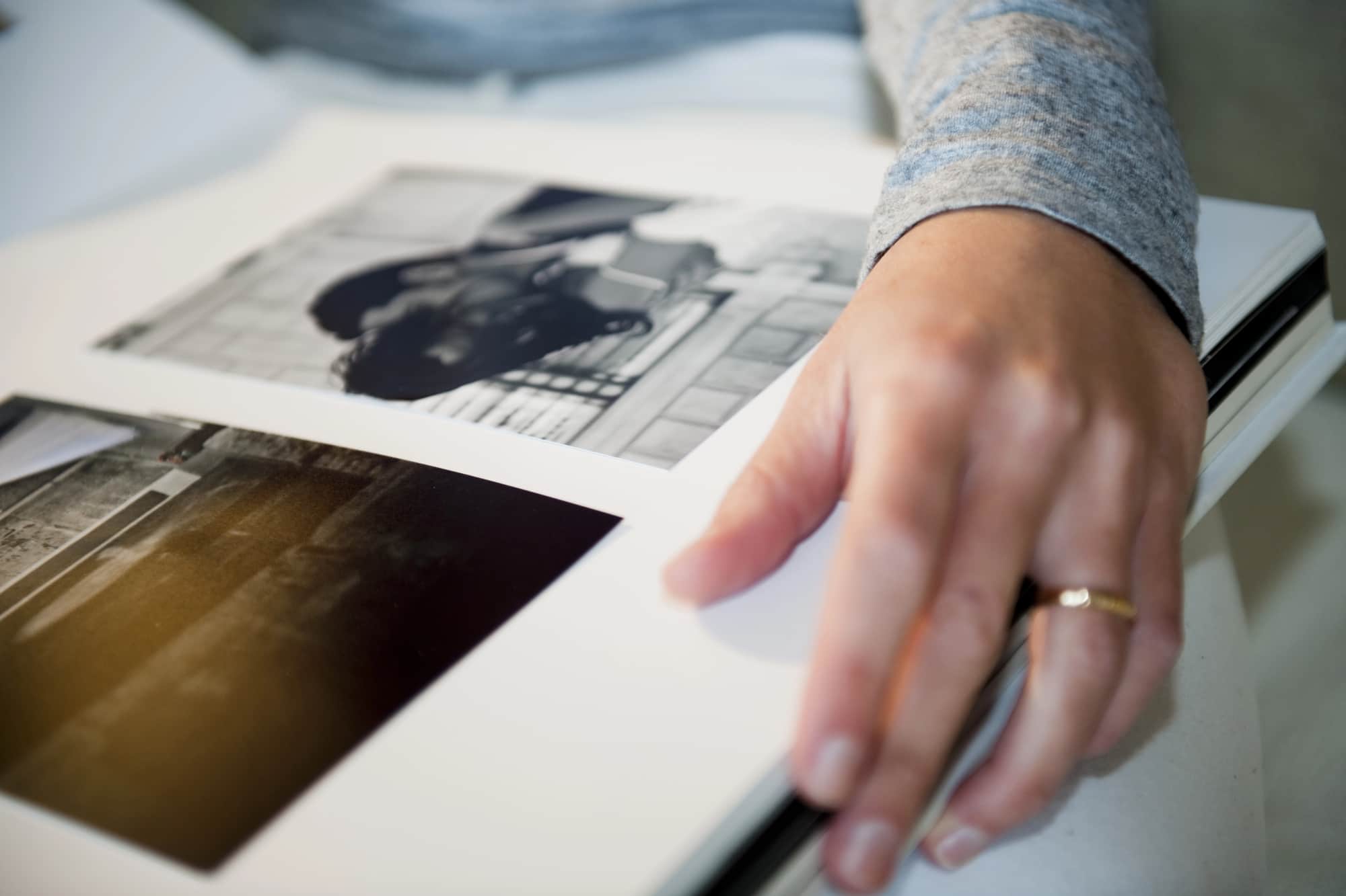 A person holding a wedding photo album