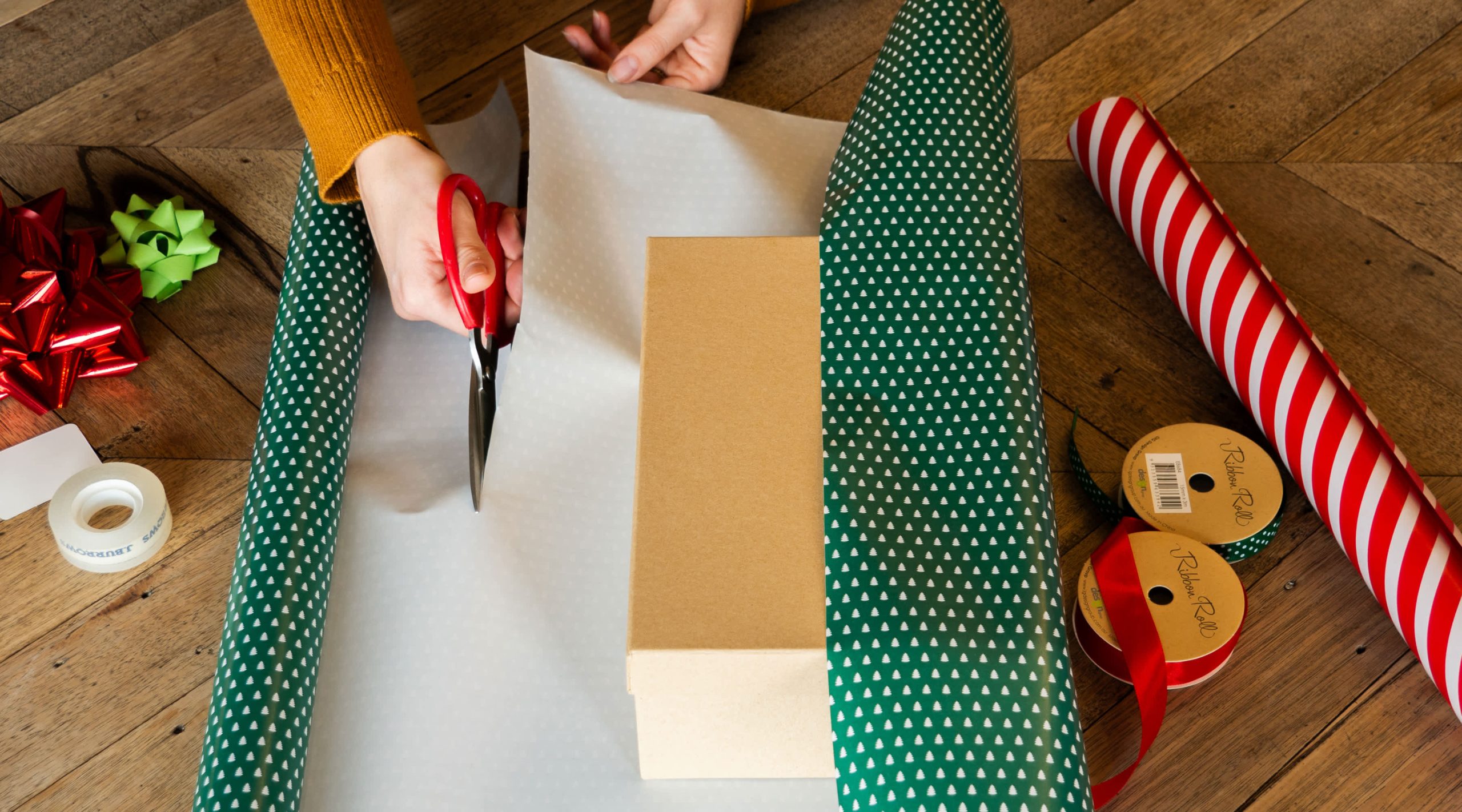 Measuring and cutting the wrapping paper for wrapping boxes