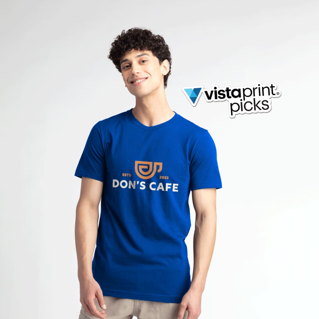 A man in a blue Bella+Canvas T-shirt with a custom logo