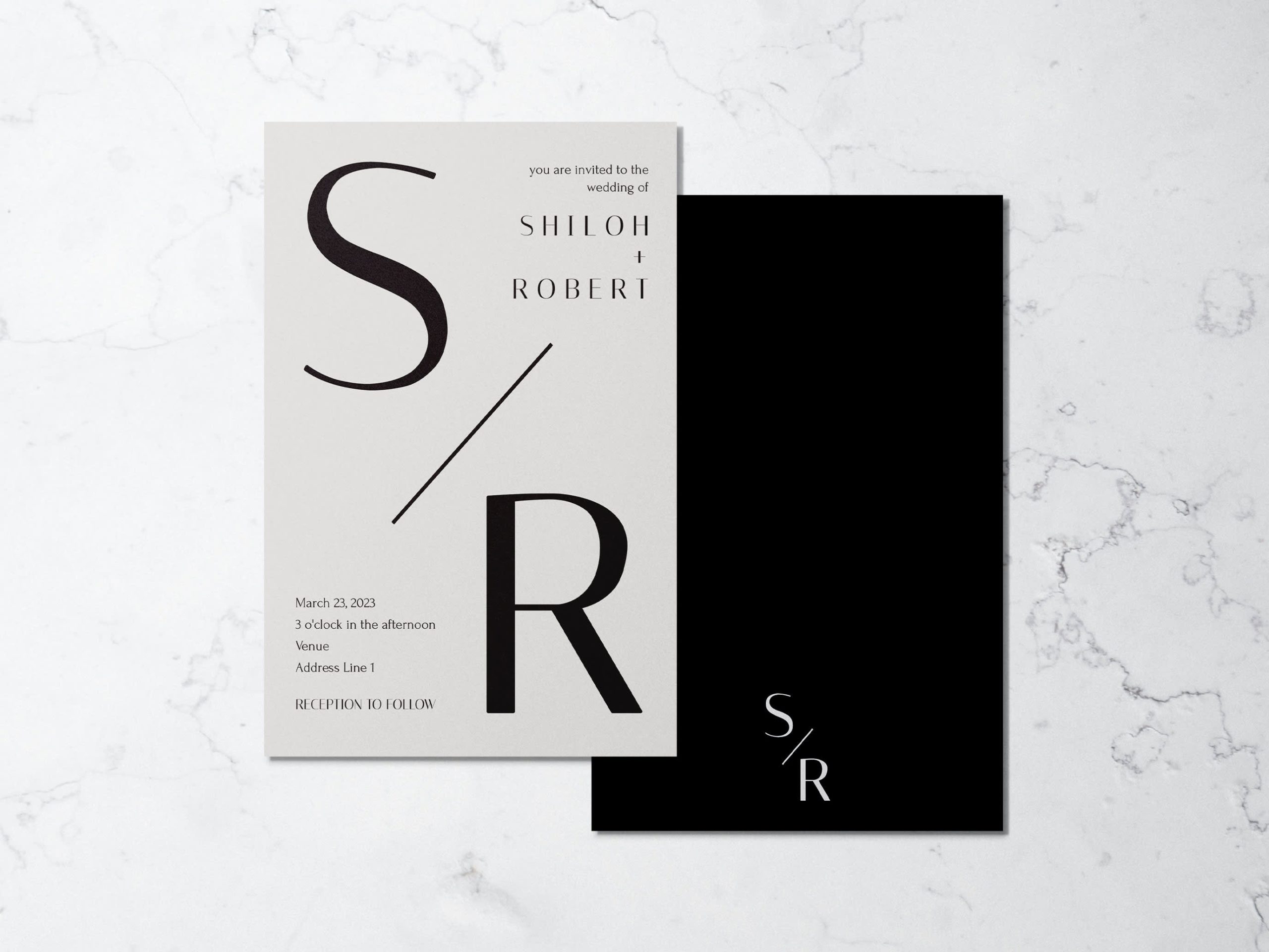 Minimalist wedding monogram logo on a wedding invitation