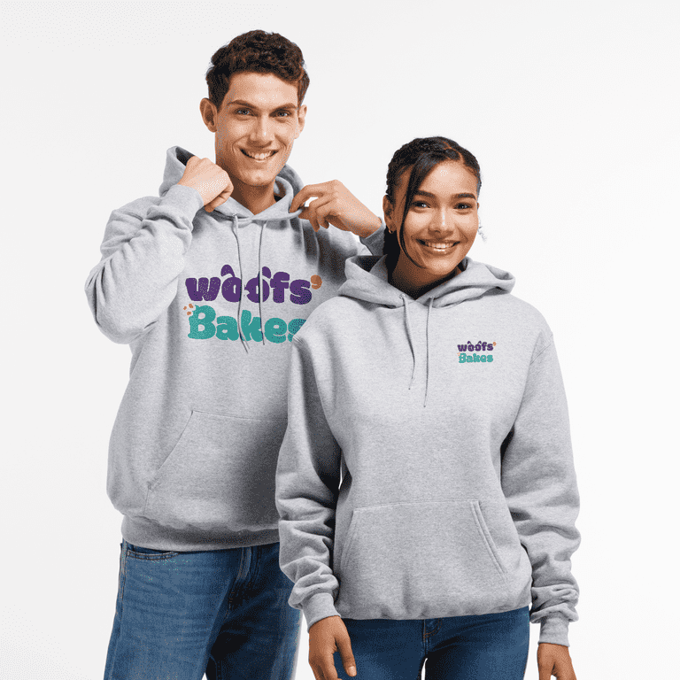 Man and woman wearing gray hoodies with dog food business logo&nbsp;