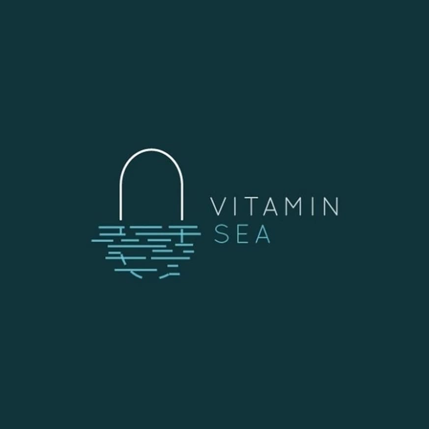 Minimalist vitamin brand logo of a capsule in a body of water