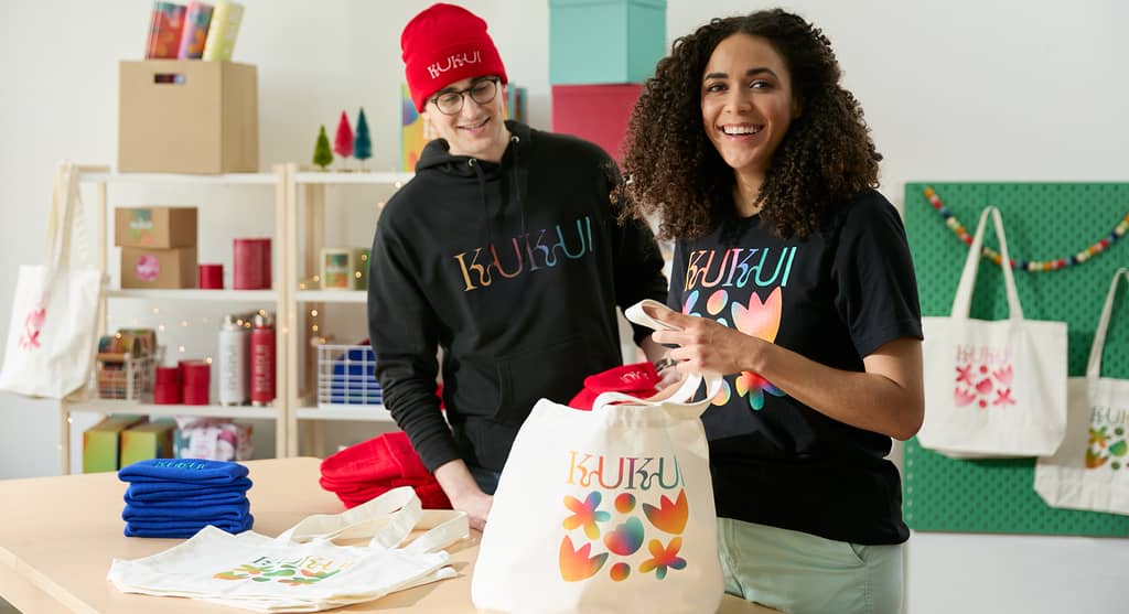company employee wearing a branded fitted hoodie