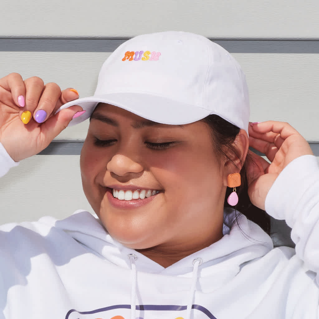 woman wearing cap merchandise with logo