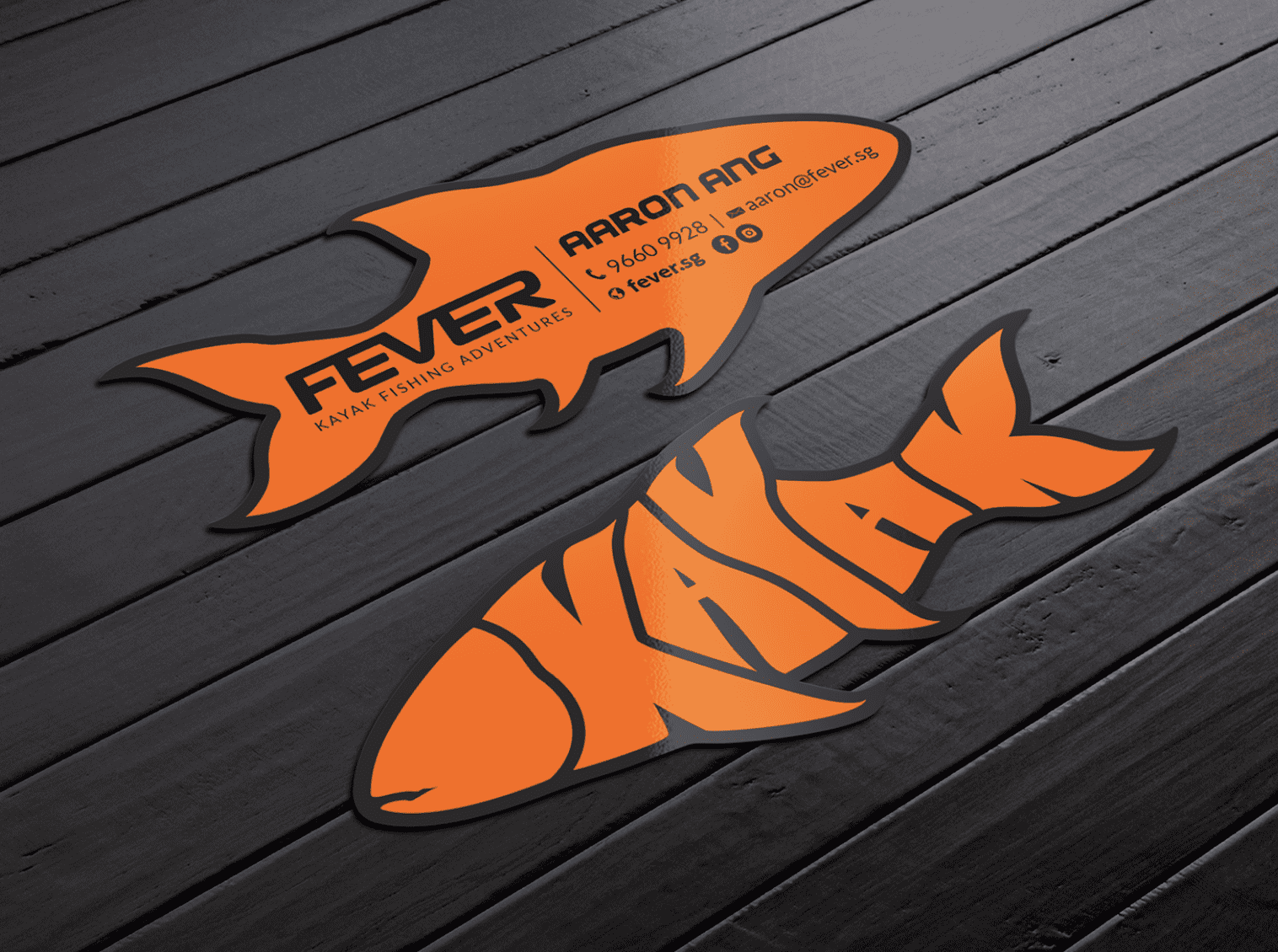 Business cards in the shape of a fish with the Instagram icon.