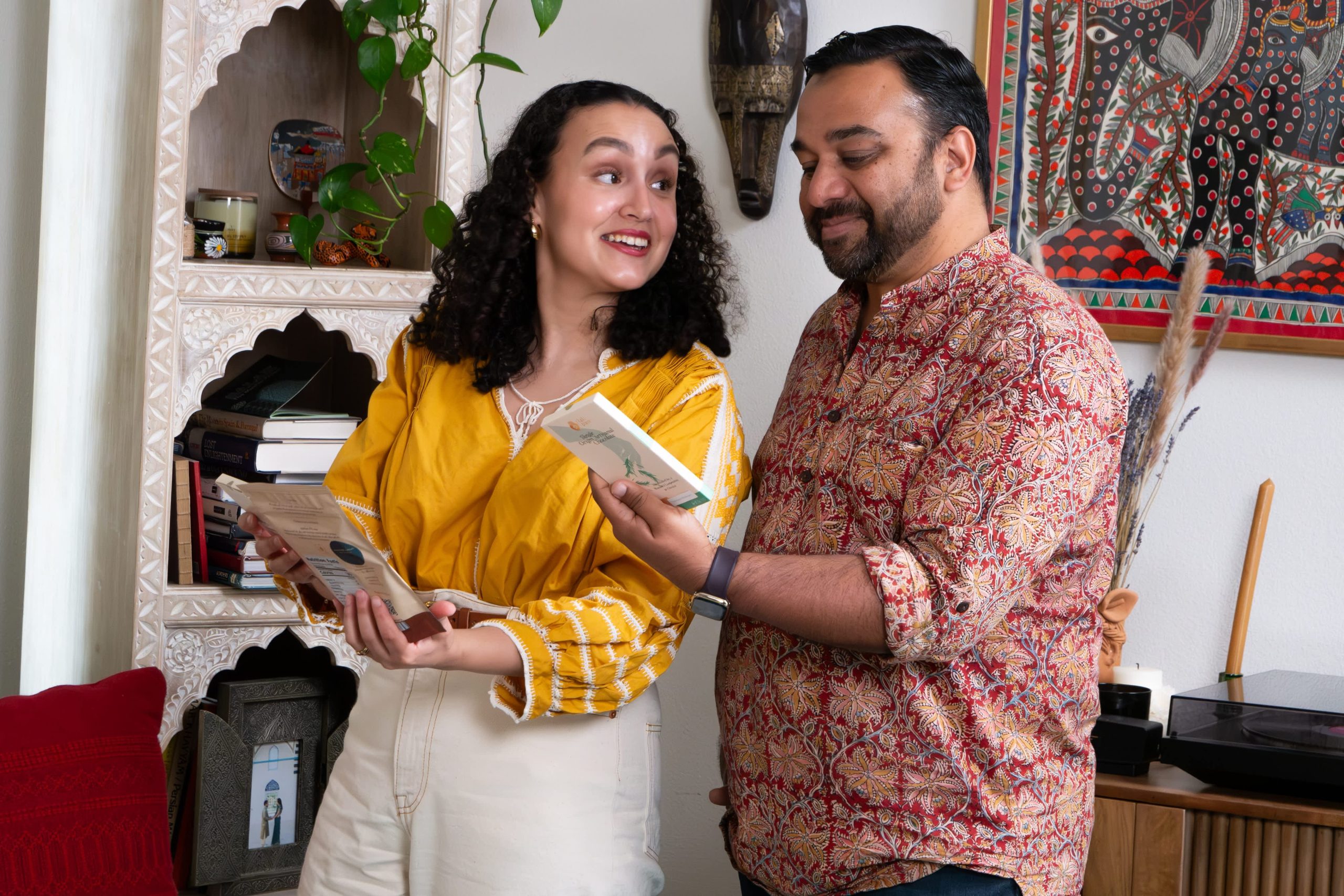 Owners of tlali•pani looking through their printed materials.