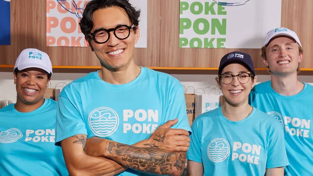 Restaurant employees wearing personalized work uniforms