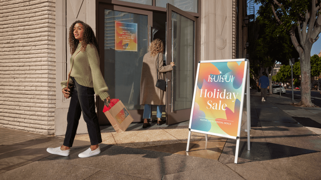 Aluminum A-frame outdoor retail store signage using brand fonts