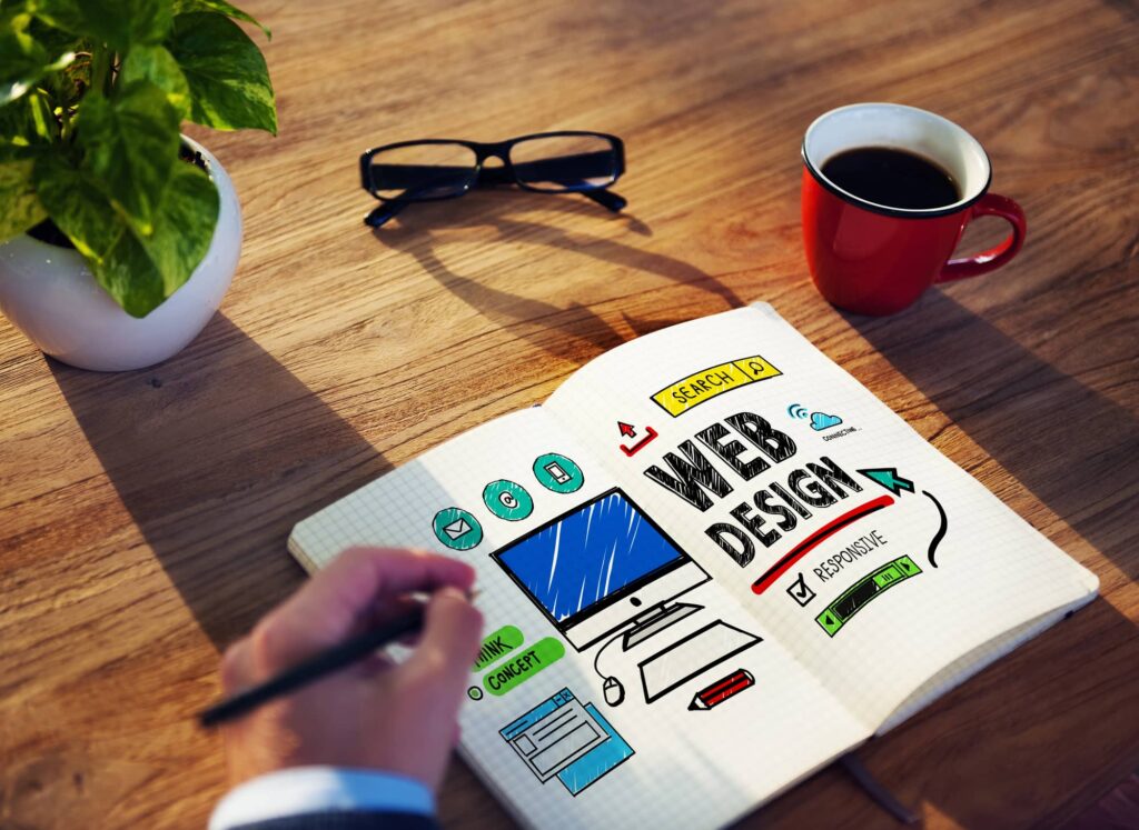 hand draws colorful wireframes of web design