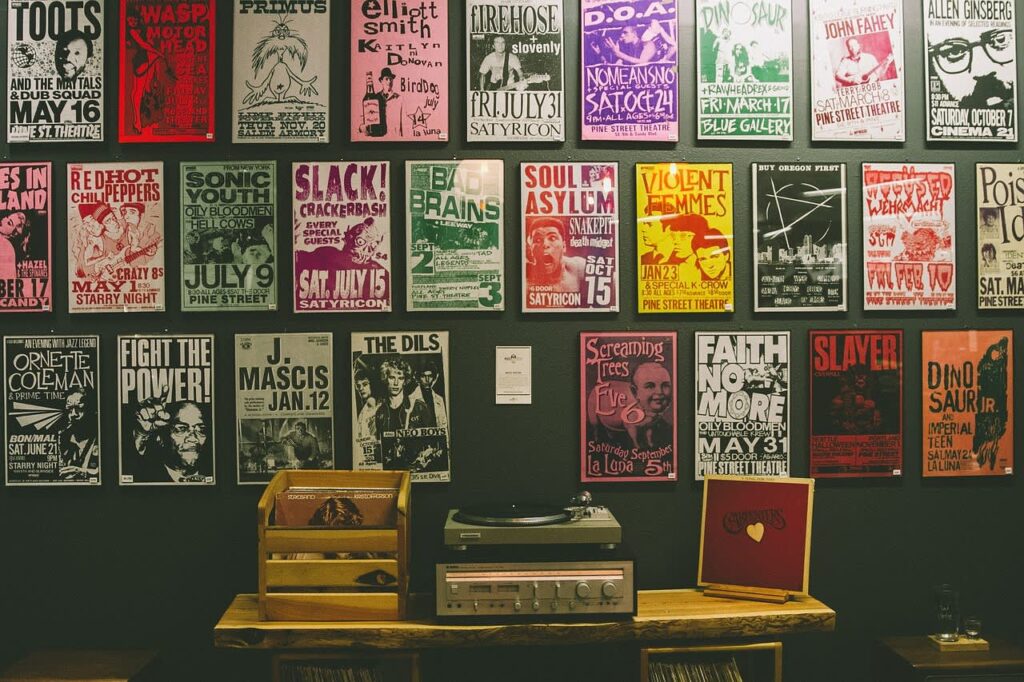 A wall covered in vintage concert posters