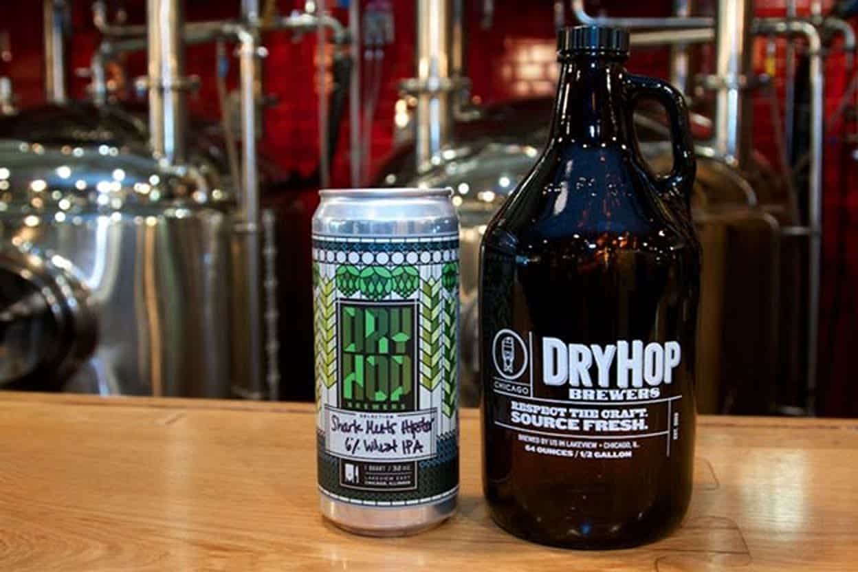 Refillable glass bottle Hop Brewing crowler can on a wooden bar.