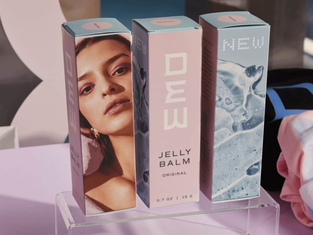 Custom pink and blue box packaging for cosmetics products with photo imagery designs and several modern stylized fonts in white and black
