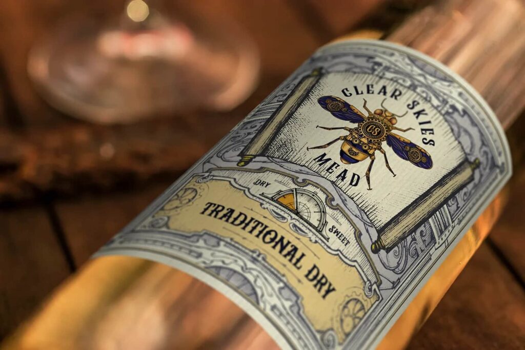 A product packaging label design featuring a vintage and classy design for Clear Skies Mead
