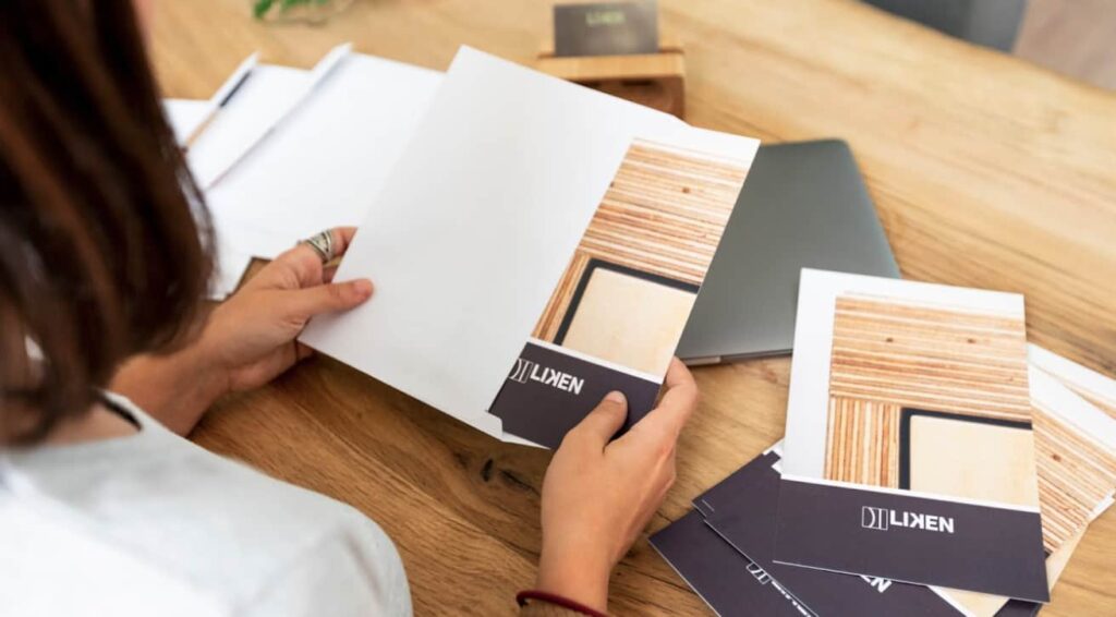 Small business owner packaging up a press kit as marketing materials for small business