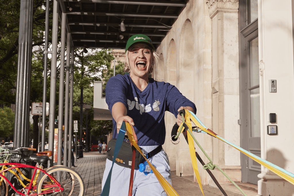 Dog walking business owner wearing a custom cap