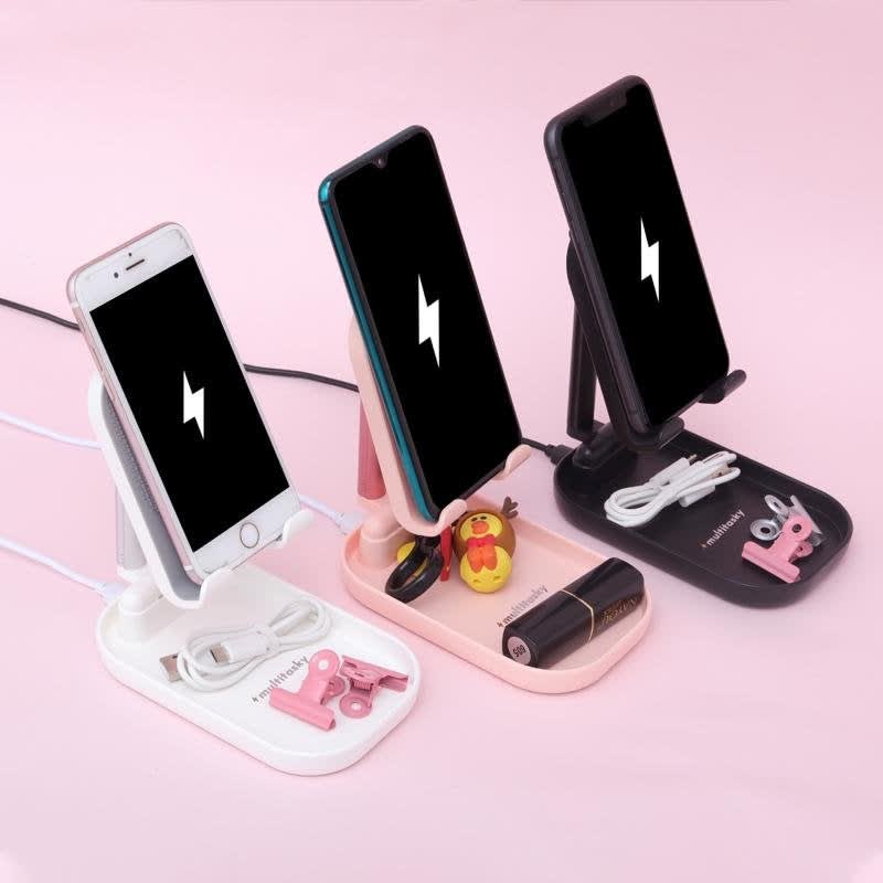 Three smartphone holders in white, pink and black