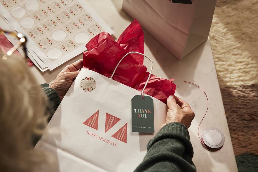 Festival holiday fonts on paper bags and hand tags