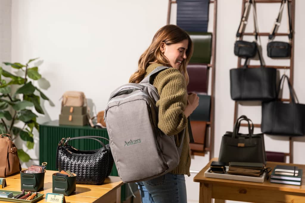 A grey branded backpack makes a great back-to-school giveaway for fall marketing