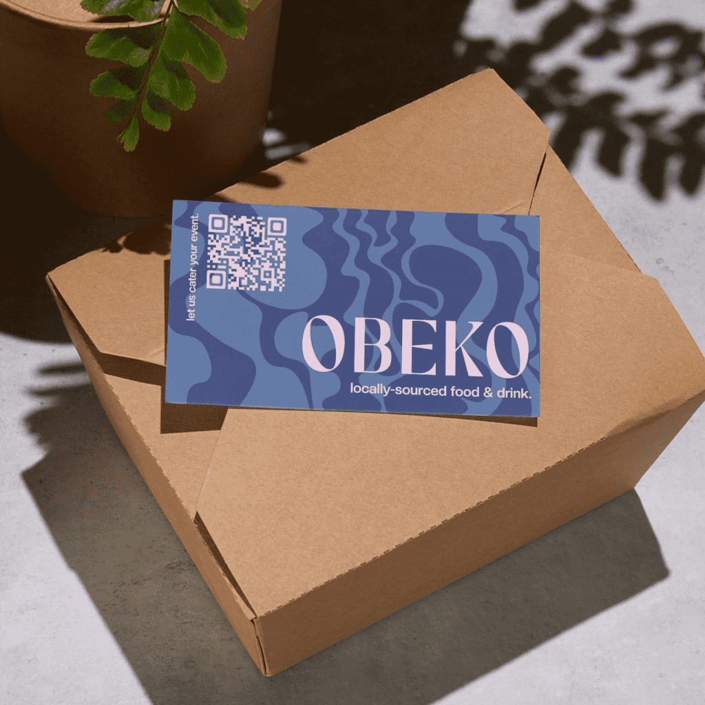 Food packaging box with branded QR code card for customer engagement