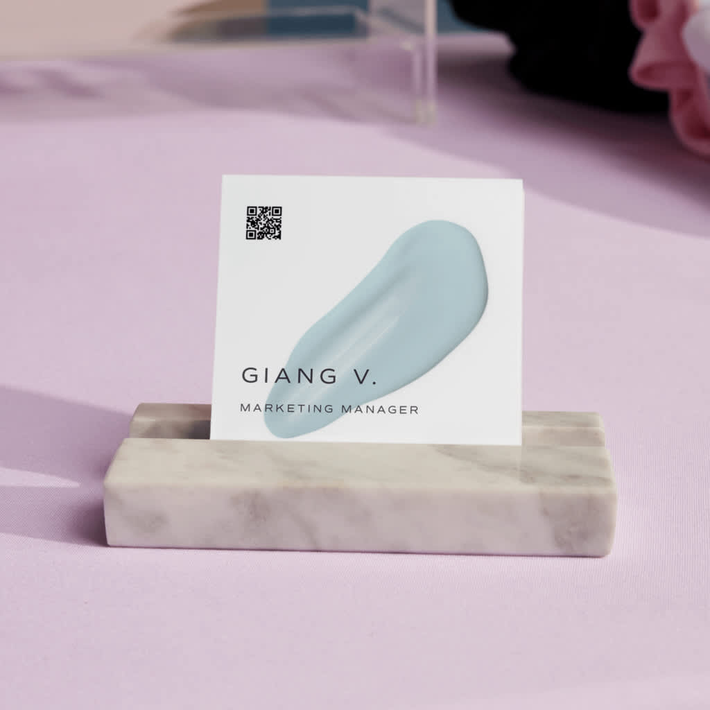 Business card with a QR code on the front, demonstrating how digital-ready designs connect customers directly to online content.