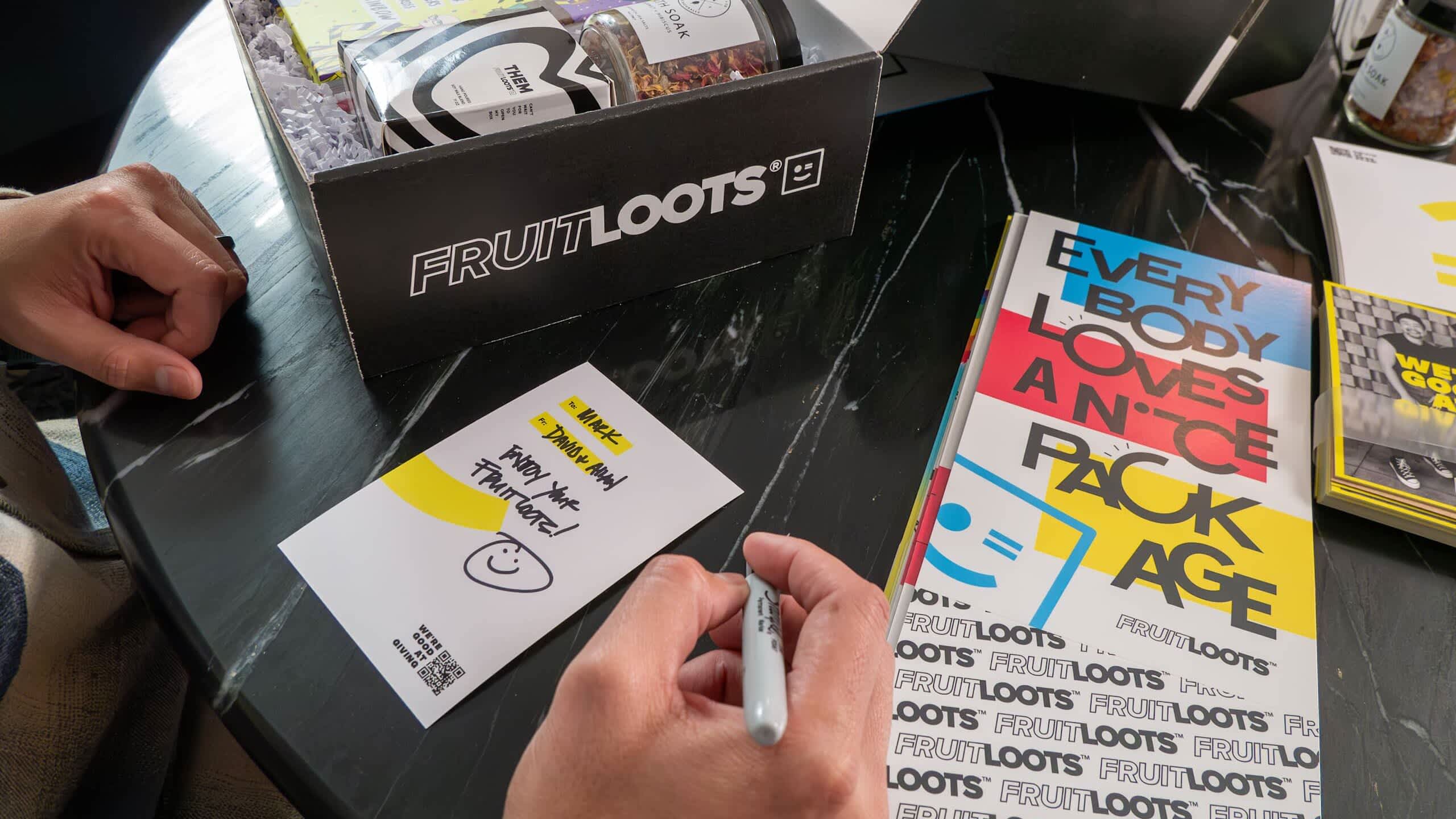 Branded postcards with hand-written notes that follow the brand&rsquo;s tone of voice, branded packaging that uses brand colors and logo &ndash; a manifestation of a brand style guide in practice