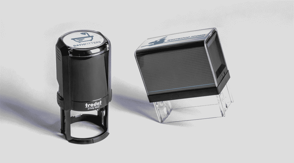Two self-inking stamps for businesses, rectangular and circle