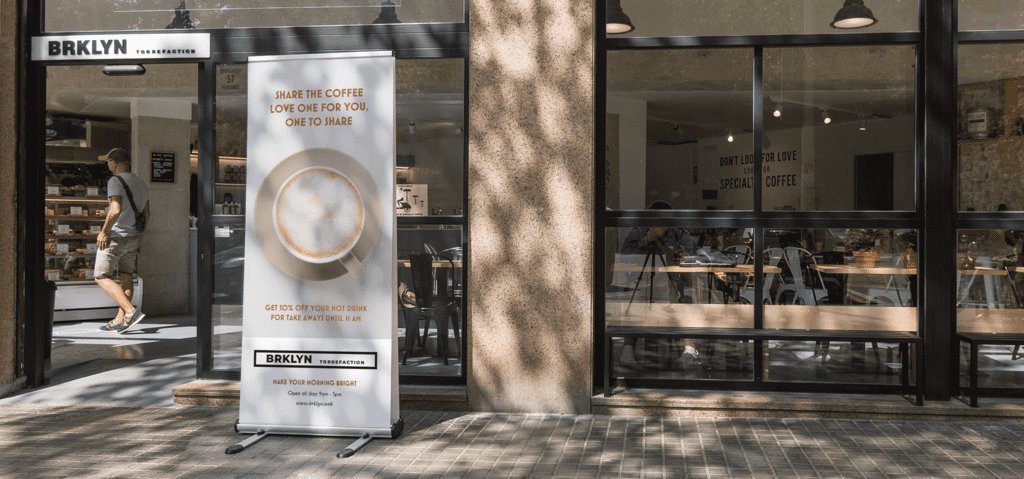 Coffee shop retractable banner on the street offering a discount