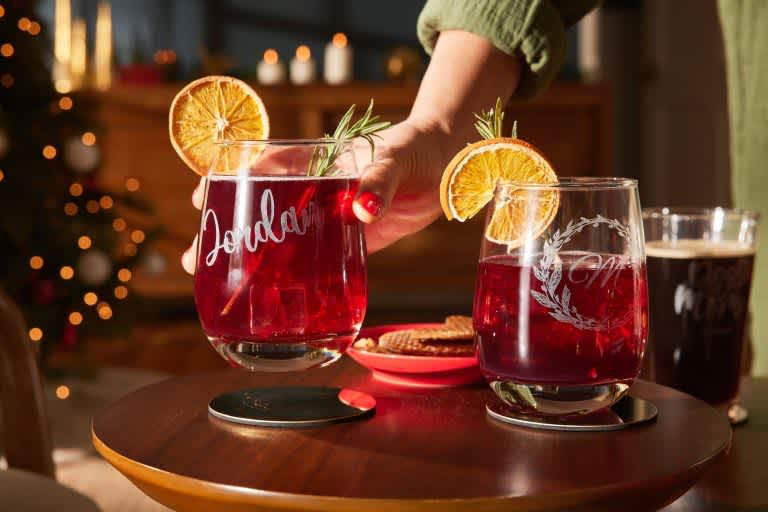 Etched wine glasses with garnishes.