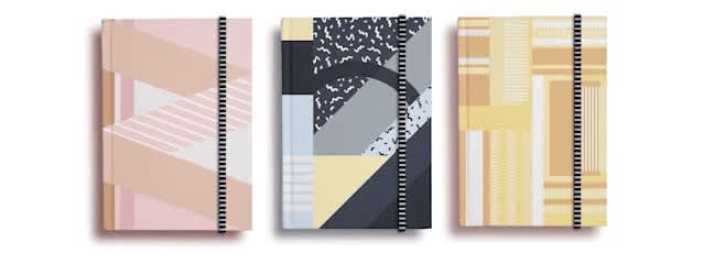 Three notebooks with geometric patterns.