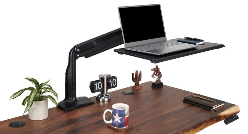 Adjustable laptop tray on a desk.
