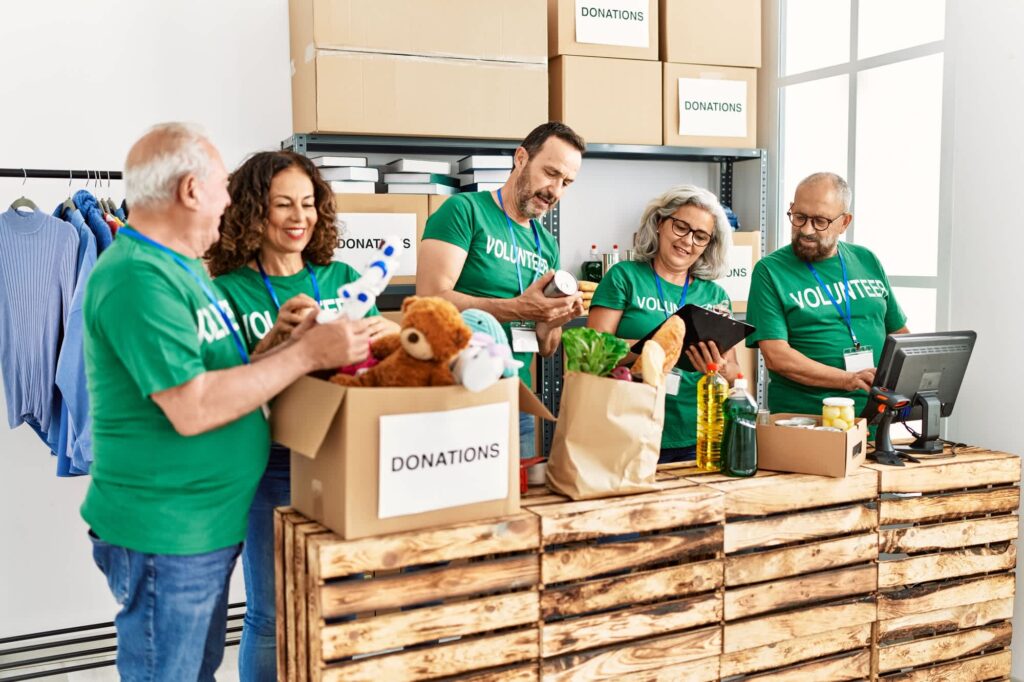 Team works together to pack donations into boxes.