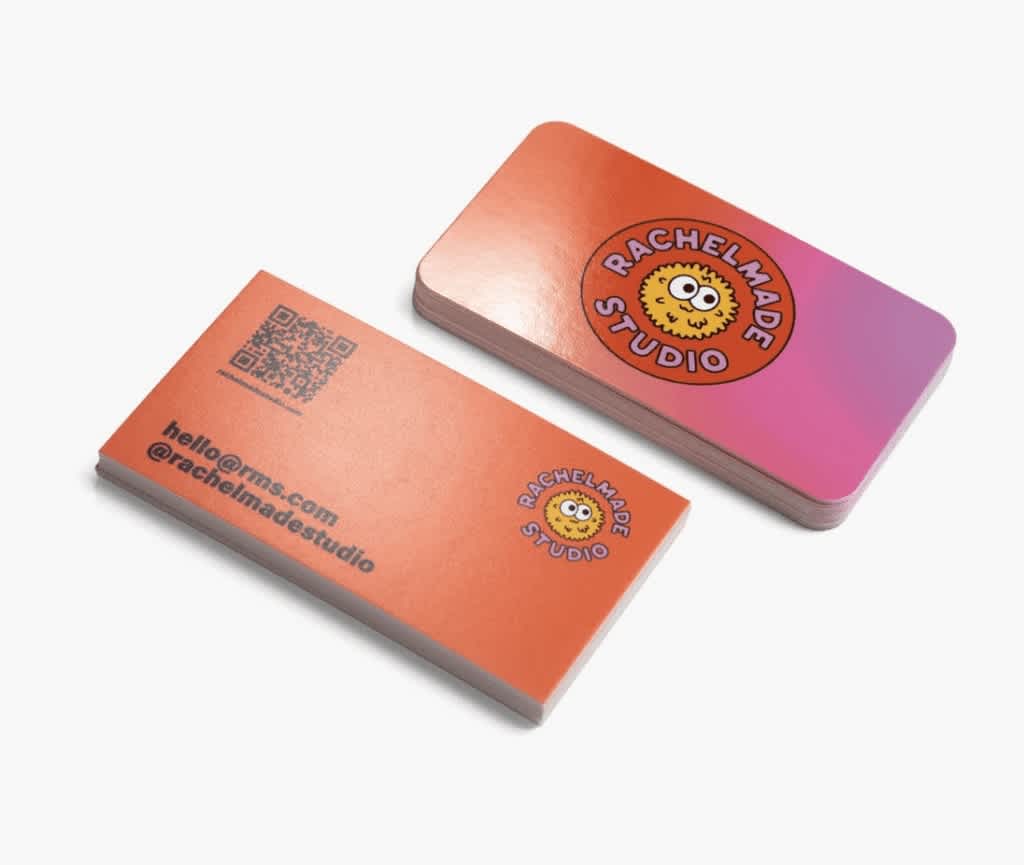 Bright orange and pink business card with bold red circular logo with bold pink text “Rachelmade Studio” on one side and black QR code and contact info on the other.