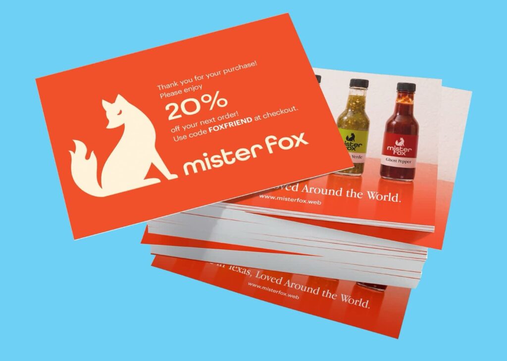 Bright orange Mister Fox packaging insert offering 20% off the next purchase with a promotional code.