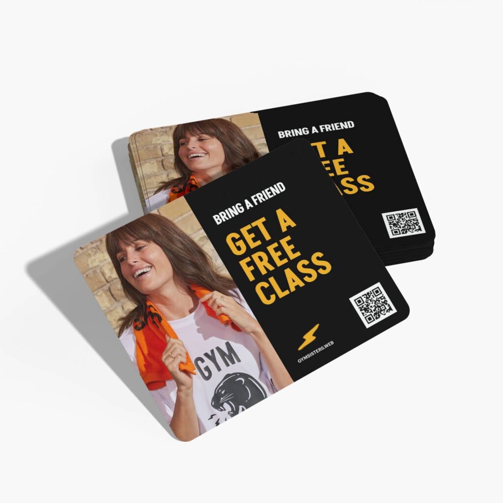 Black gym referral cards featuring a customer photo, a free class offer and a QR code.